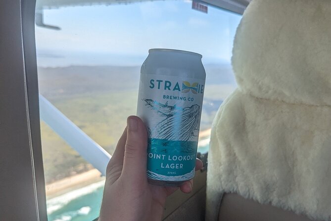 1 Hour Private Flight Tour with Paired Inflight Beer Tasting - Jumpinpin IPA above blue water