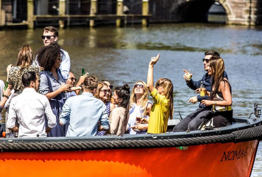 Amsterdam: Canal Belt Private Beer Boat Tour - Leaving the dock beside Seapalace
