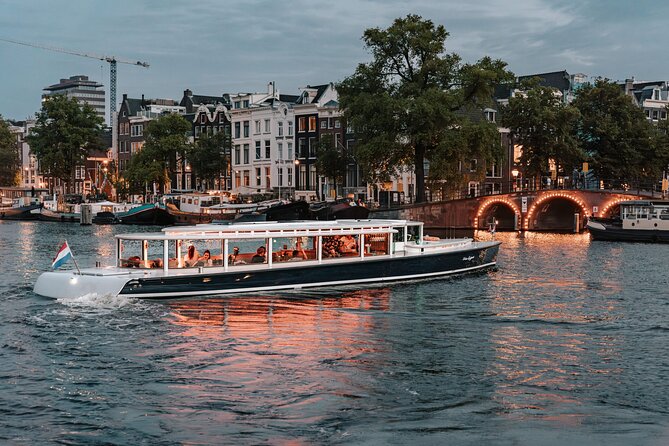 Amsterdam Small-Group Evening Canal Cruise Including Wine, Craft Beer, Cheese - A full loop through Amsterdam’s canal districts