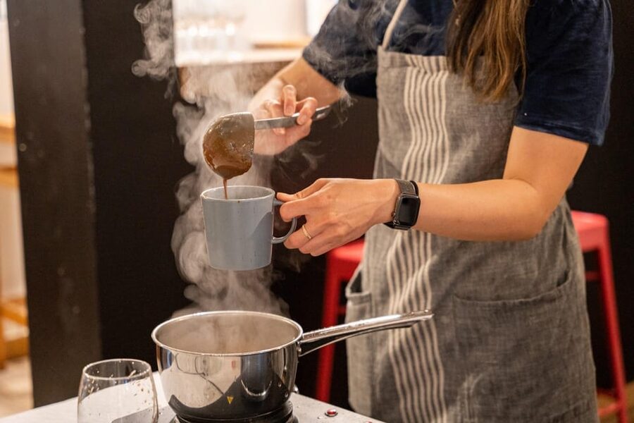Bruges: Belgian Chocolate Making Workshop with Beer Tasting - Forming praline shells with dark Callebaut chocolate