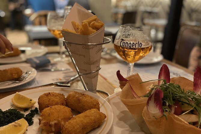 Brussels Food Tour: 10 Tastings of Waffles, Beers, Fries & More - Meeting the guide at the Auguste Orts statue