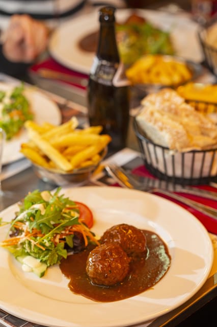 Brussels Food Tour: Main Dish, Beer, Waffle & Chocolate - Meatballs, Belgian fries and a proper first course