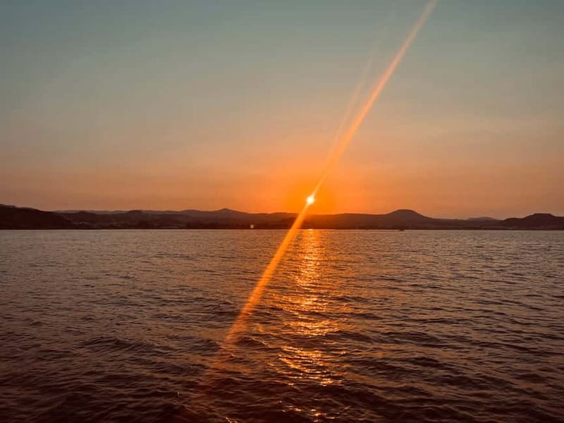 Faliraki: Sunset Cruise with Unlimited Aperol, Beers & Wine - Anthony Quinn Bay and Ladiko Bay from the water