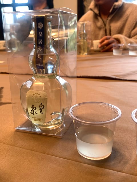 Kobe: Sake Brewery Tour with Tasting and Kobe Beef Bites - The Train Ride Across Kobe