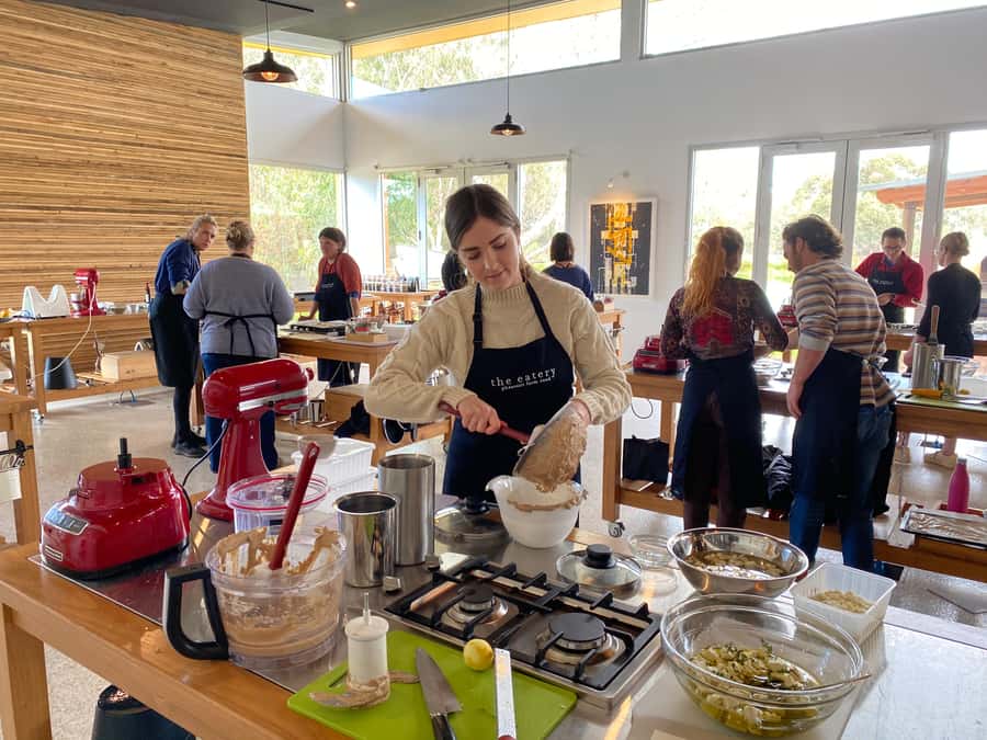 Maggie Beer's Farm Hands-on Cooking School and Lunch - Putting on the apron and cooking a course