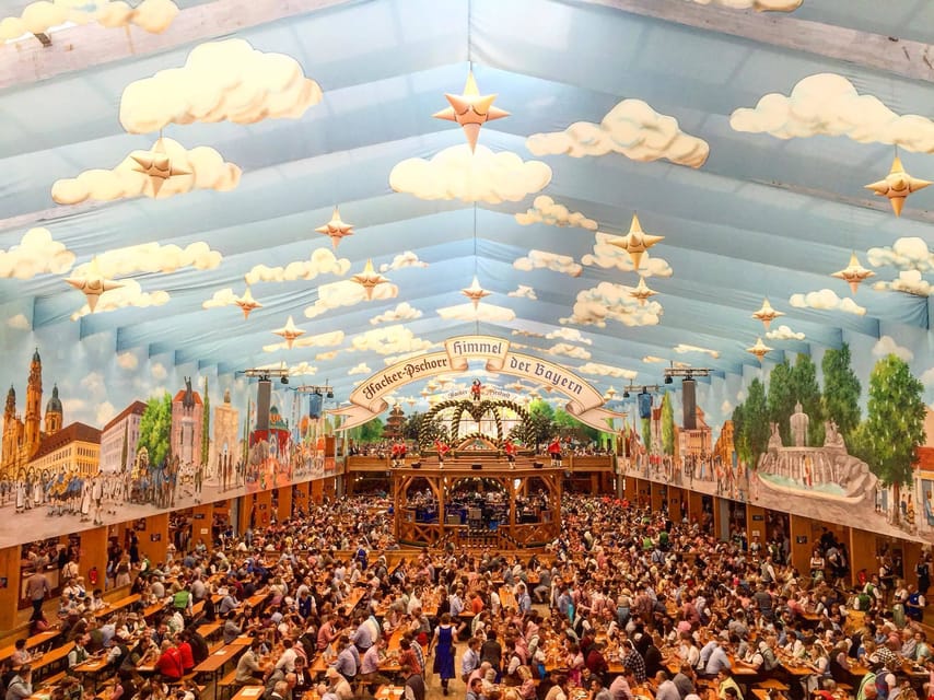 Munich: Oktoberfest Tour with Tent Reservation, Food & Beer - Inside the beer tent: food, beer, and singing