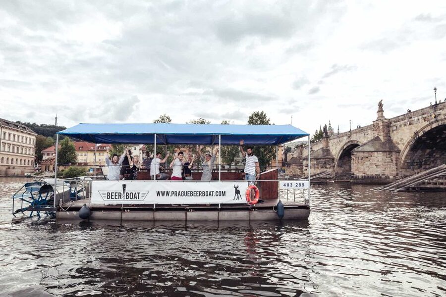 Prague: Private Cycle Boat River Tour with Beer or Prosecco - A party boat with Prague views