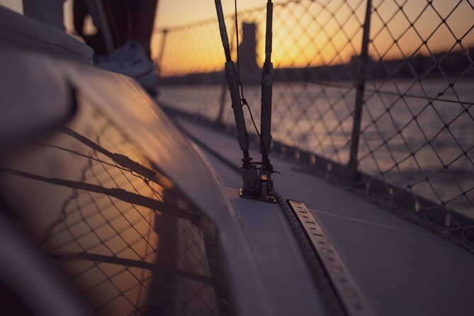 Sunset sailboat tour in Lisbon with green wine - Passing beneath the bridge