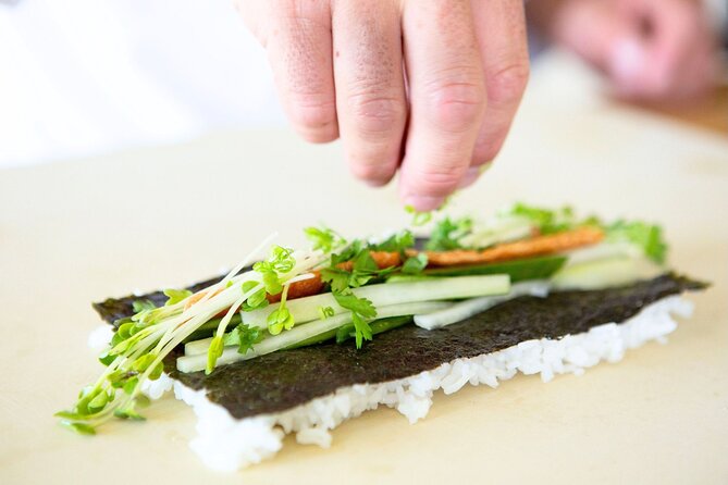 Sushi Making Cooking Class at a Local Brewery in Charlotte - Rolling the spicy tuna sushi