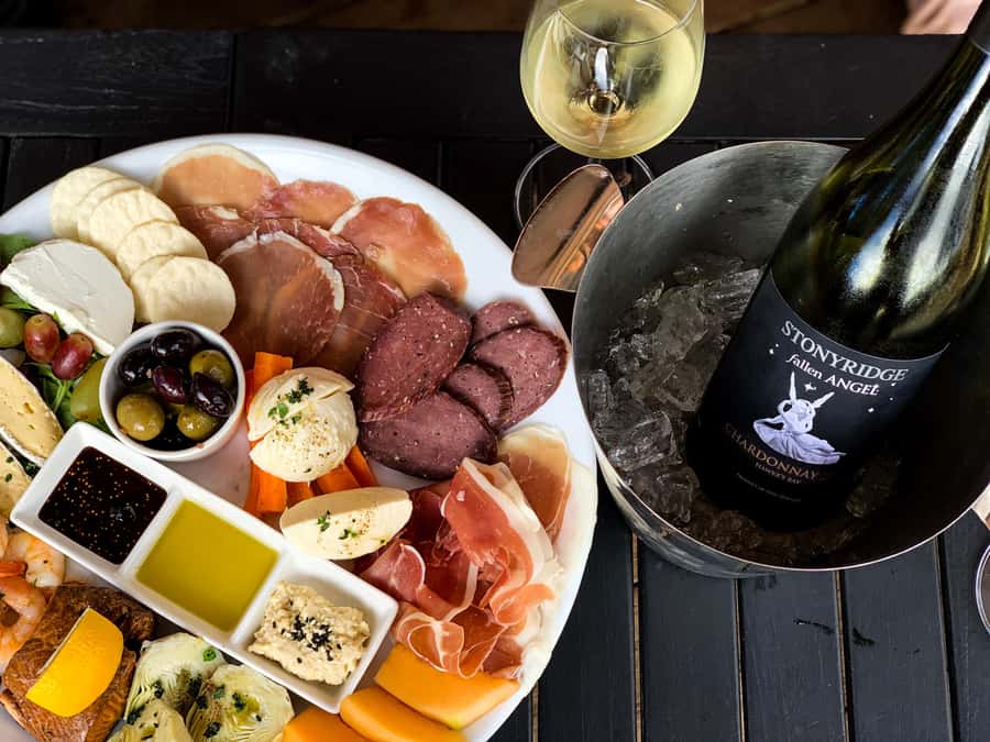 Waiheke: Scenic Taste and Graze Tour with Wine, Whisky, Beer - Mudbrick: wine with Auckland in the distance